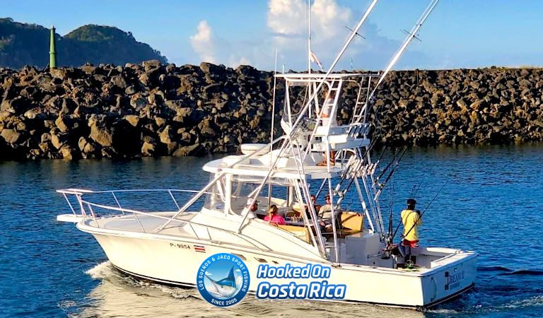 32 foot Luhrs Express open sportfishing boat navigating near the marina jetty